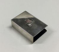 An unusual silver matchbox holder mounted with an