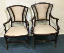 A pair of inlaid chairs with pink upholstered seat