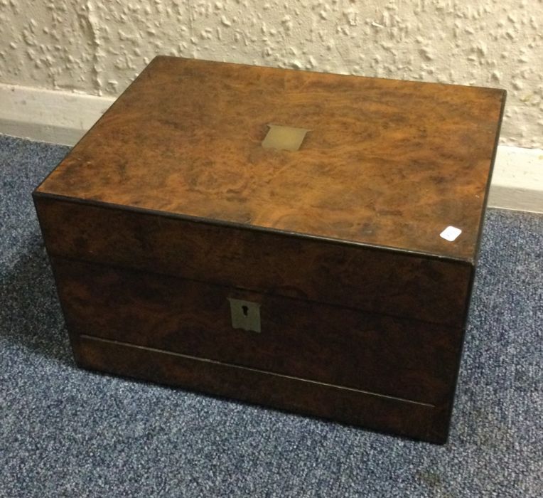 A burr walnut hinged top jewellery box. Est. £30 -