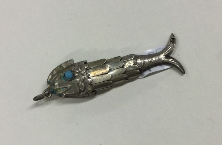 A small Continental silver figure of a fish with a