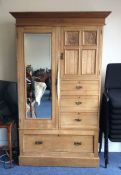 A satinwood four drawer compactum wardrobe. Est. £