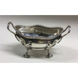 A good Georgian silver butter dish of stylised for