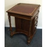 A good mahogany four drawer sloping top Davenport