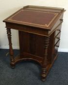 A good mahogany four drawer sloping top Davenport