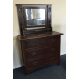 A pine three drawer carved dressing chest. Est. £2