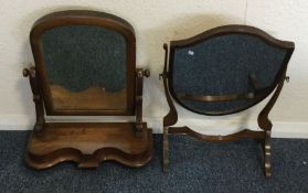 Two mahogany toilet mirrors. Est. £20 - £30.