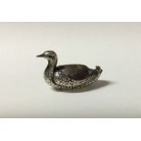 An unusual silver pic cushion in the form of a duc