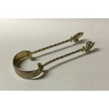 A good pair of Victorian silver sugar tongs with g