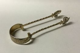 A good pair of Victorian silver sugar tongs with g