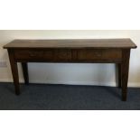 A Georgian style oak three drawer side table with