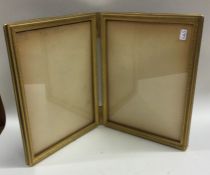 A good Antique brass mounted double fold picture f