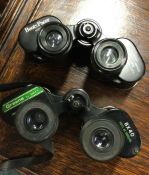 Two pairs of cased binoculars. Est. £20 - £30.