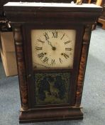 An old mahogany cased wall clock. Est. £30 - £50.