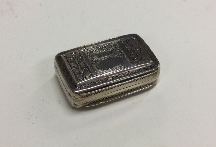 A good Georgian silver hinged top engraved vinaigr