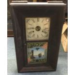 An old mahogany cased wall clock. Est. £30 - £50.