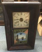 An old mahogany cased wall clock. Est. £30 - £50.