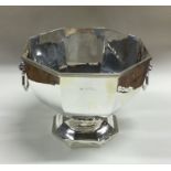 A large silver two handled rose bowl with lion mas
