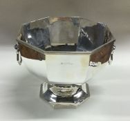 A large silver two handled rose bowl with lion mas