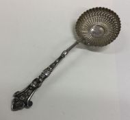 A French silver gilt preserve spoon with pierced d