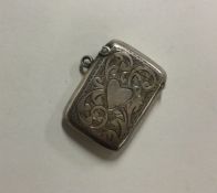 A hinged silver engraved vesta case. Birmingham. B