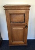 An Edwardian mahogany single door cabinet on four