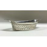 An Edwardian silver boat shaped dish with pierced