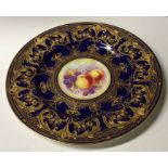 A Royal Worcester decorative gilded plate signed M