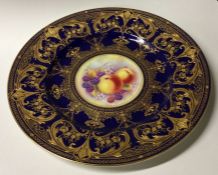 A Royal Worcester decorative gilded plate signed M