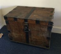 An Antique oak and cast iron mounted plate chest.