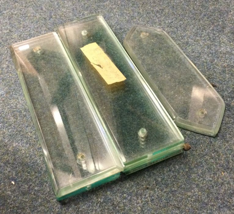 A collection of eleven glass door push plates. Est