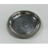 DUBLIN: A circular silver pin tray with gadroon ri