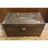 A large rosewood tea caddy of shaped form to hinge