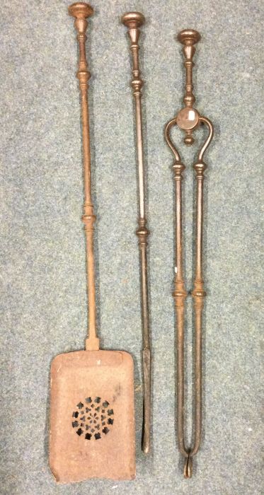 A cast iron three piece companion set. Est. £50 -