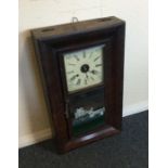 A Continental mahogany framed wall clock. Est. £20