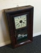 A Continental mahogany framed wall clock. Est. £20