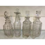 A pair of square cut glass decanters together with