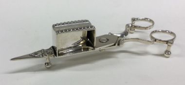 A good pair of Georgian silver candle snuffers wit