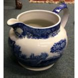A large blue and white jug. Est. £15 - £20.