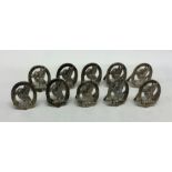 A good set of ten cast silver menu holders of larg