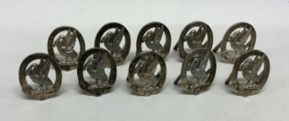 A good set of ten cast silver menu holders of larg