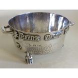 A good stylish silver two handled bowl on three re