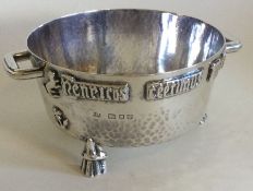 A good stylish silver two handled bowl on three re