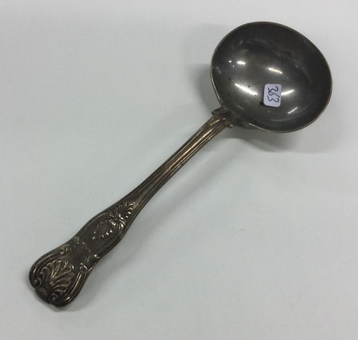 A Kings' pattern silver sauce ladle. London. Appro