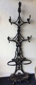 A cast iron stick stand / coat rack of typical for