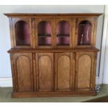 A good walnut four drawer side cabinet with dome t