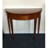 A good mahogany bow front card table on tapering s