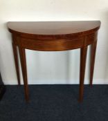 A good mahogany bow front card table on tapering s