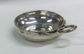 A heavy 18th Century French silver wine taster wit