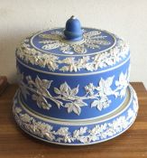 A large Wedgwood blue and white cheese dome and st