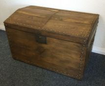 A dome top trunk with stud decoration. Est. £20 -